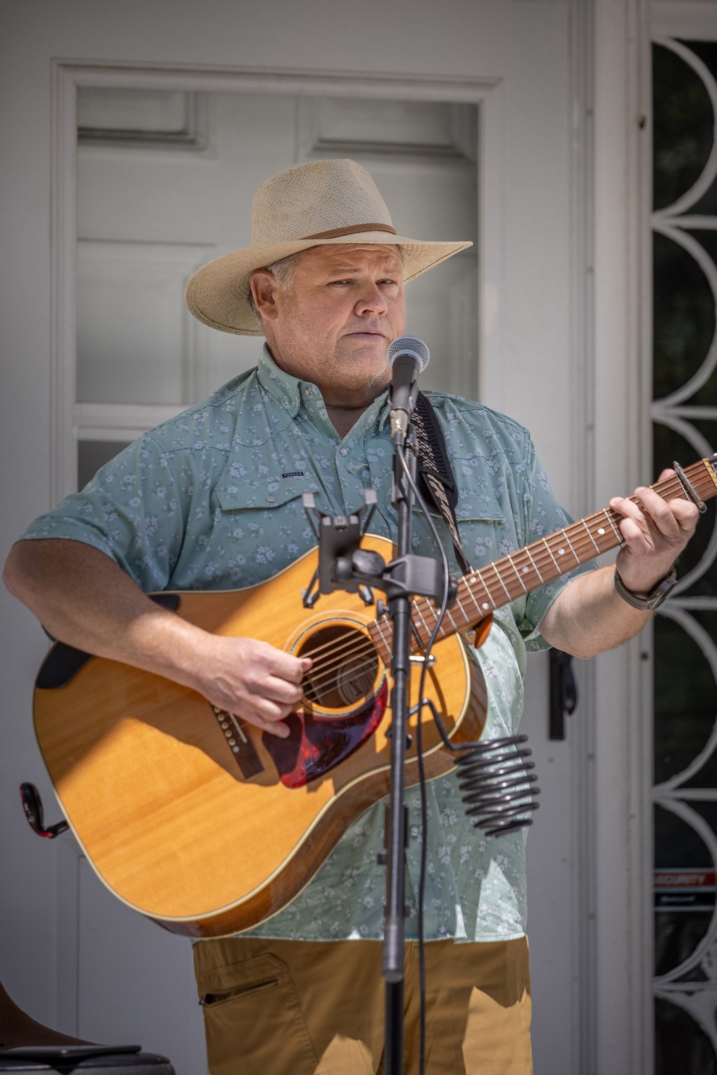 Mike performing with acoustic guitar